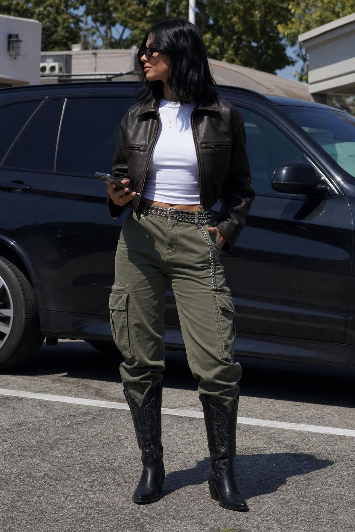 Woman wearing cargo pants with cowboy boots
