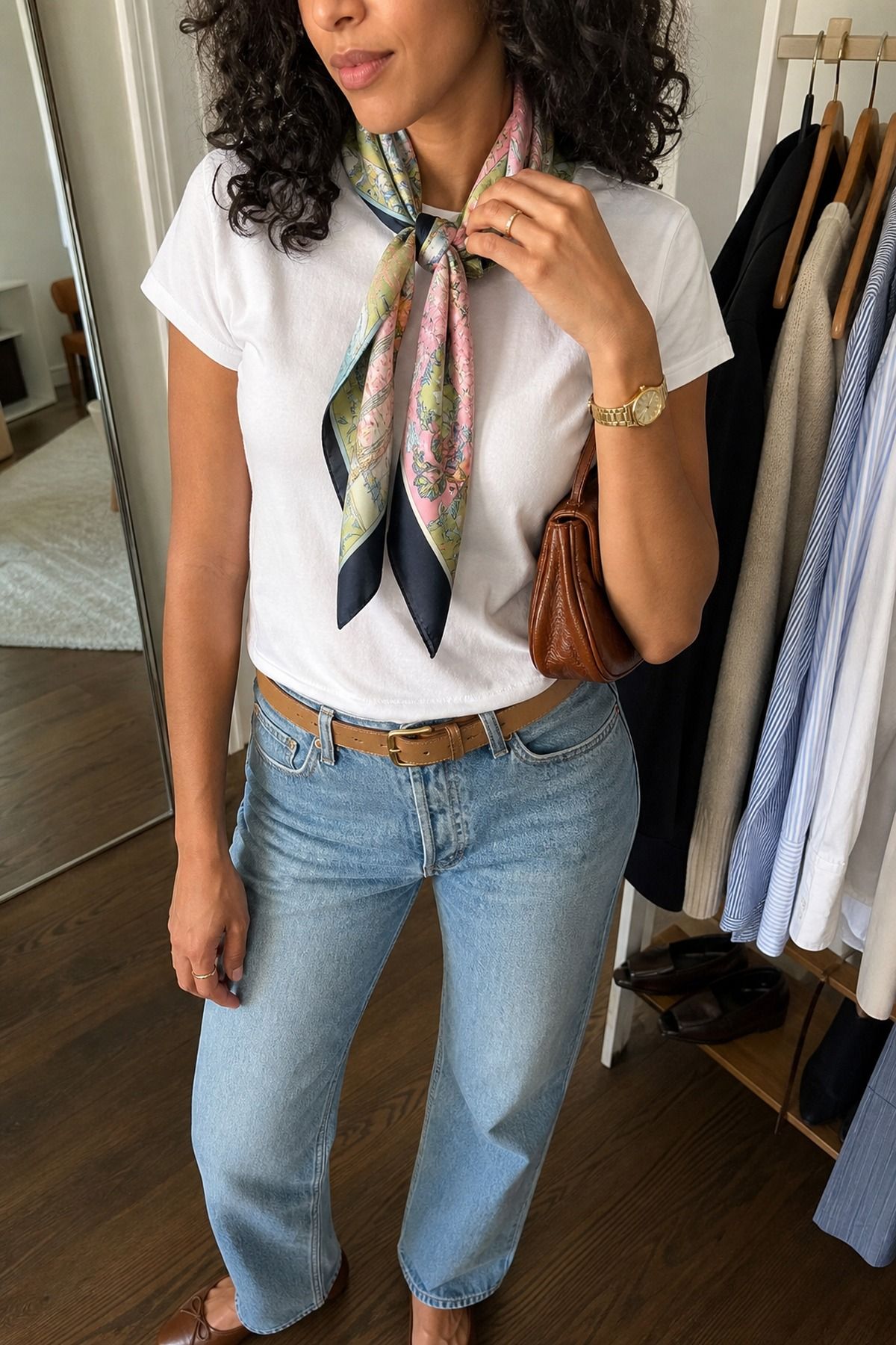 Woman wearing a silk scarf with a simple tee, an effortless chic outfit
