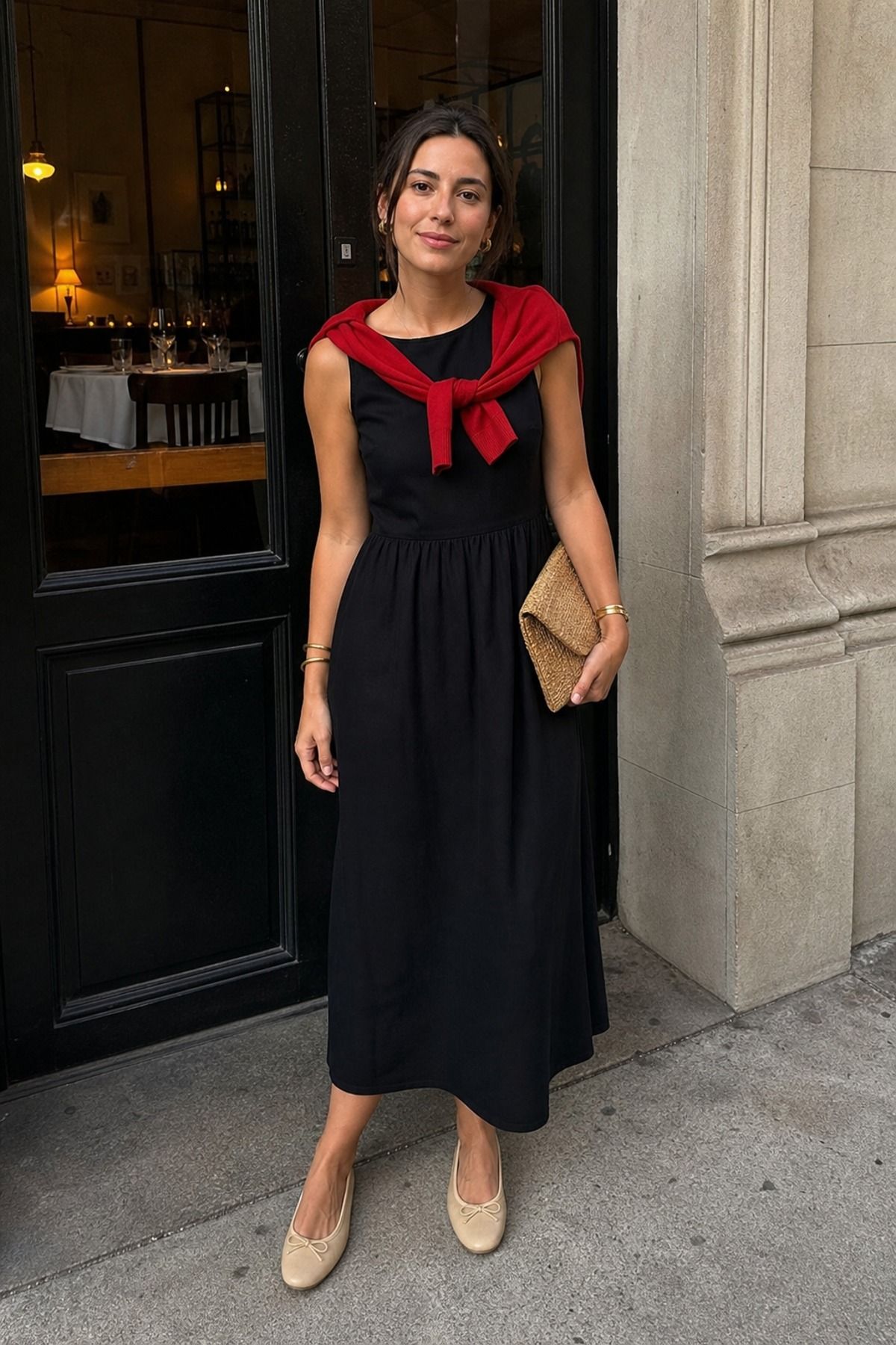 Woman wearing a black midi dress with ballet flats, a French girl casual outfit