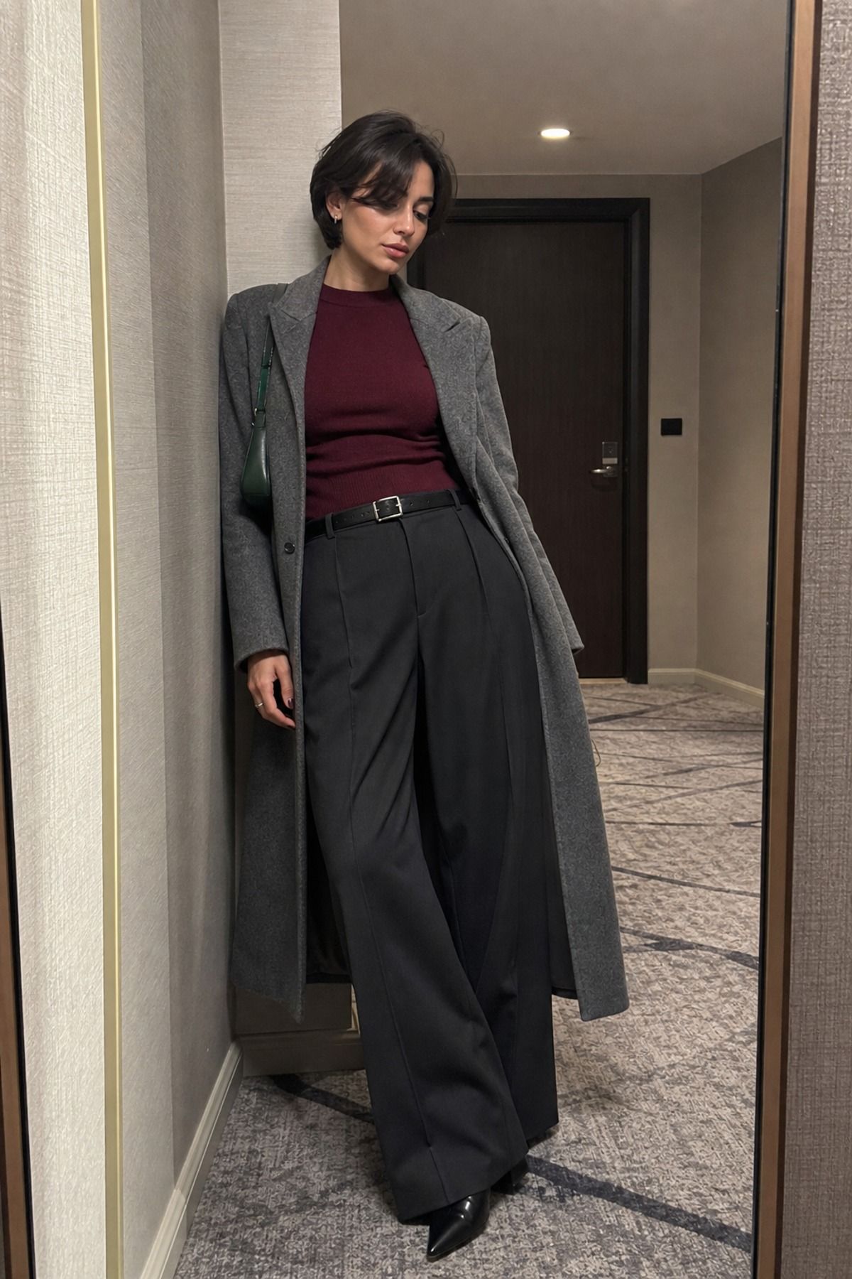 Woman wearing wide-leg trousers with knee-high boots