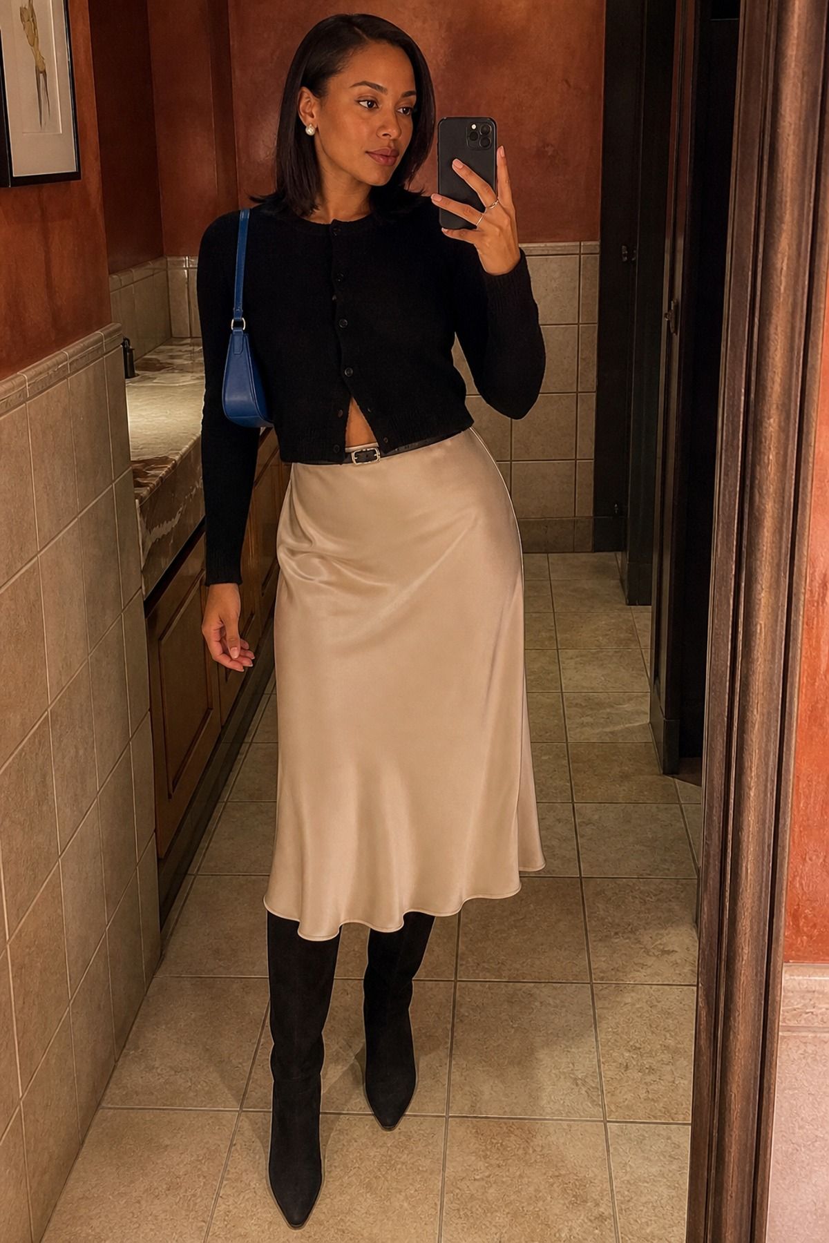 Woman wearing a slip skirt with knee-high boots