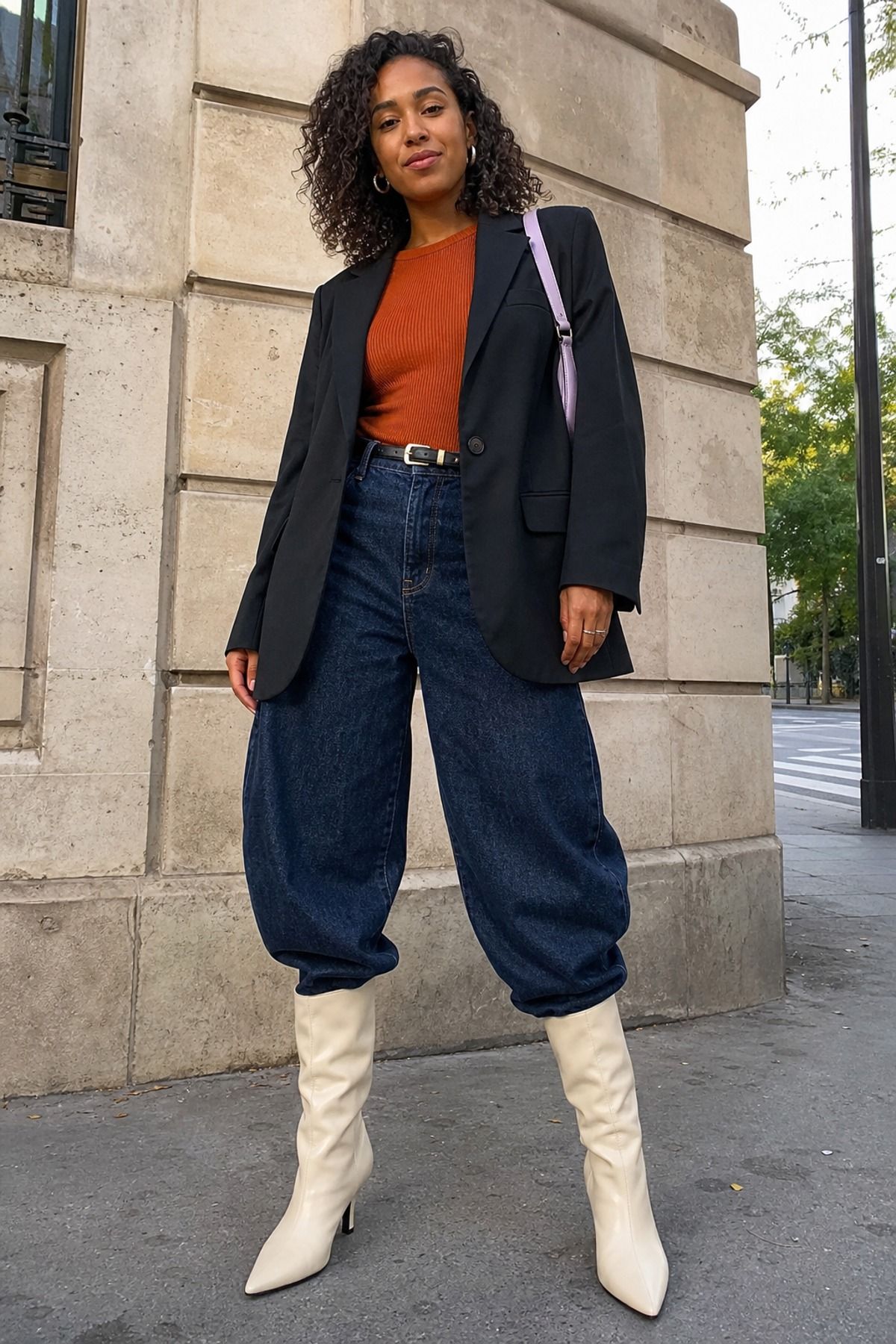 Woman wearing barrel jeans with knee-high boots
