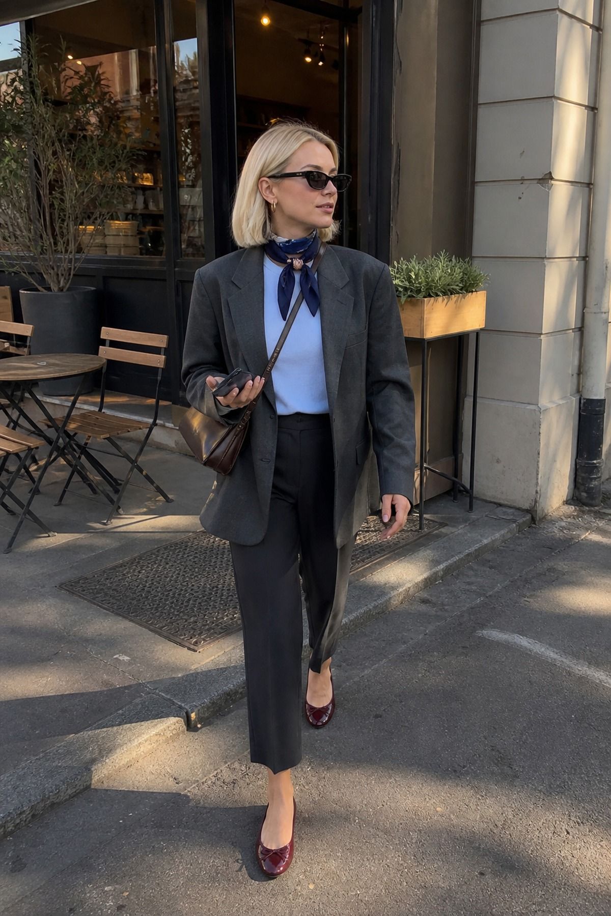 Woman wearing a blazer outfit with a scarf