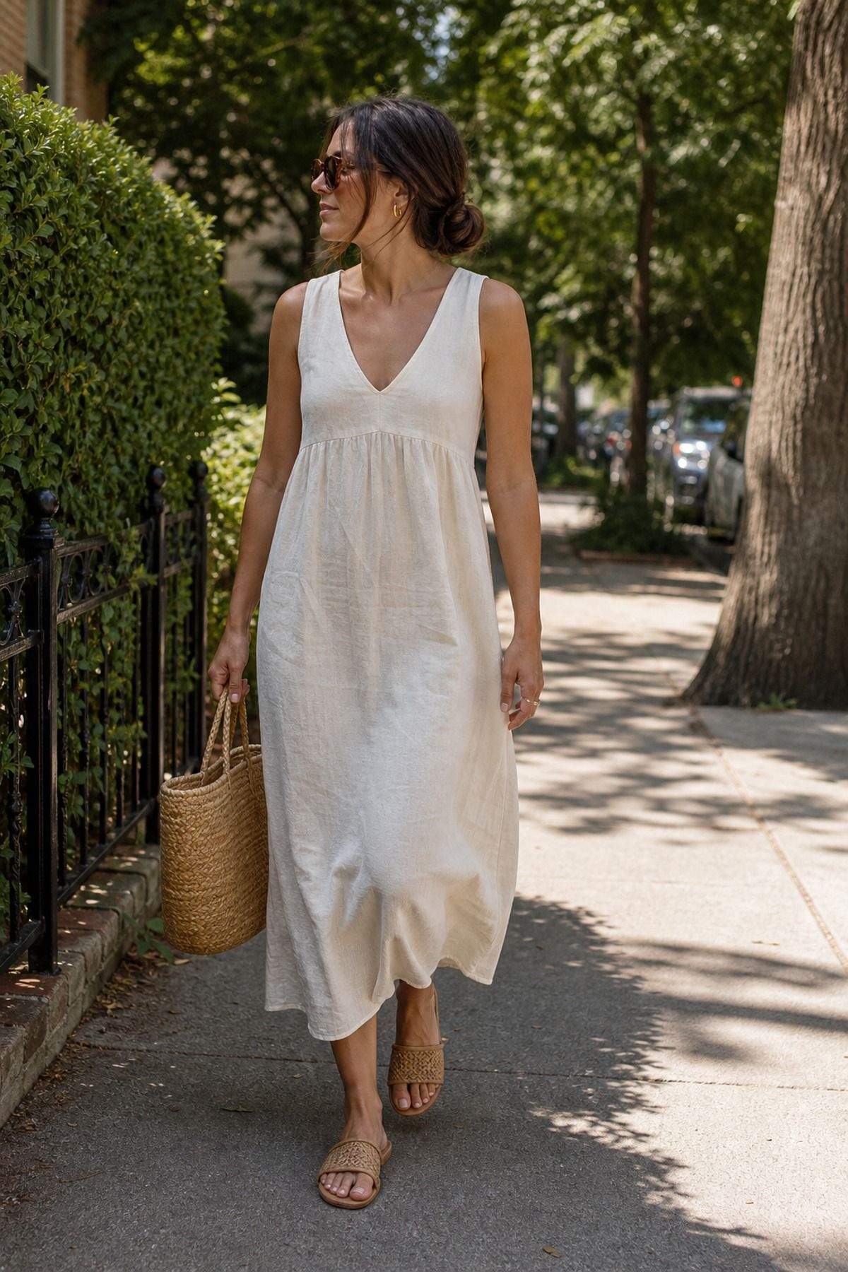 Woman wearing a linen dress with sunglasses