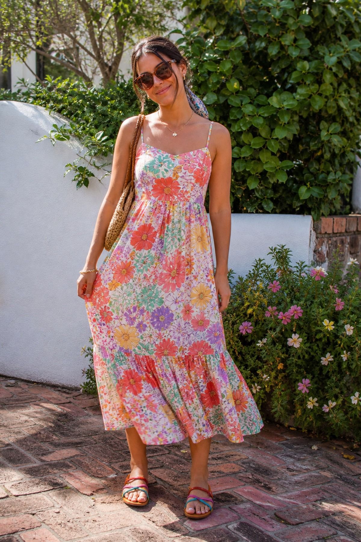 Woman wearing a sundress with sunglasses
