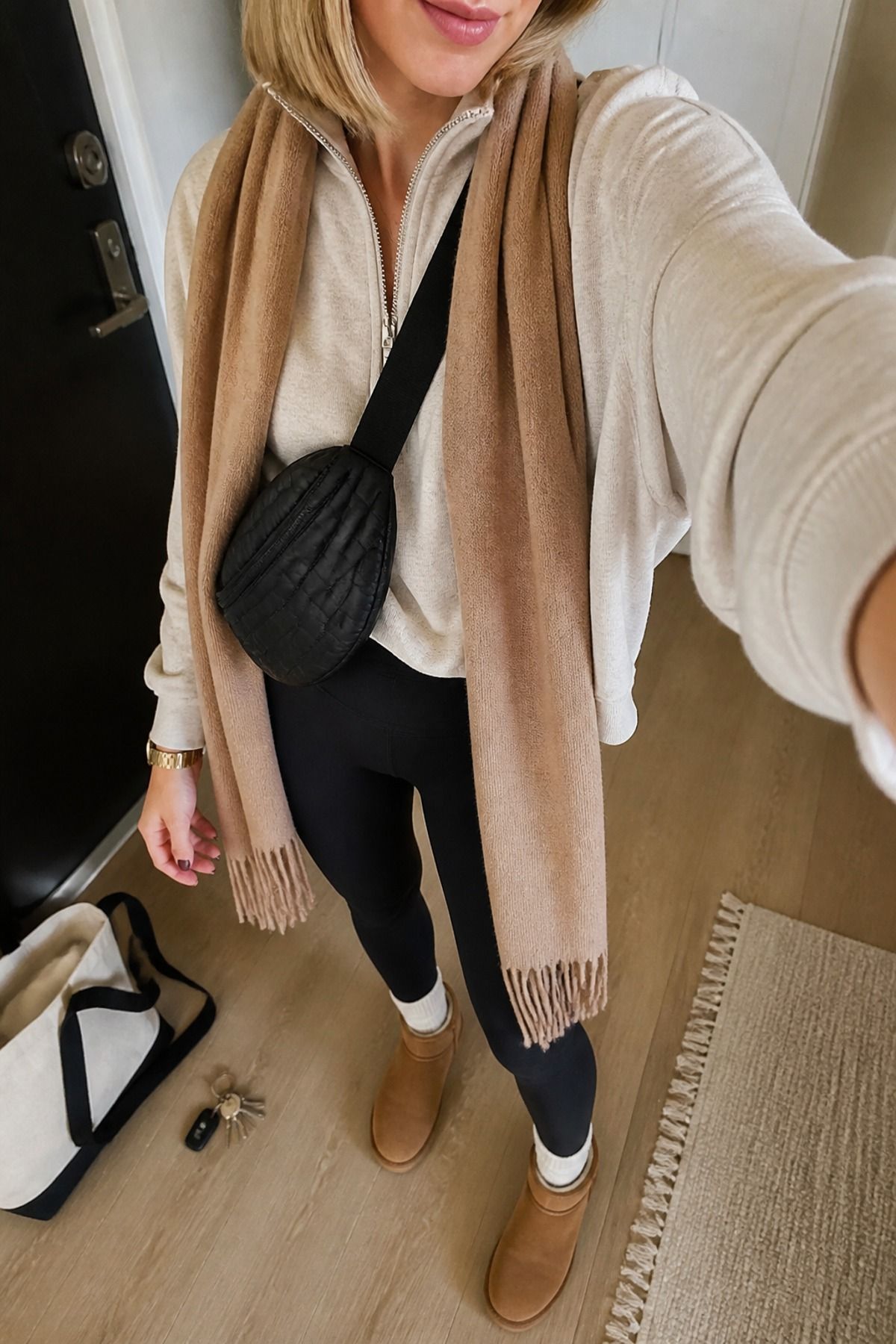 Woman wearing leggings with Uggs