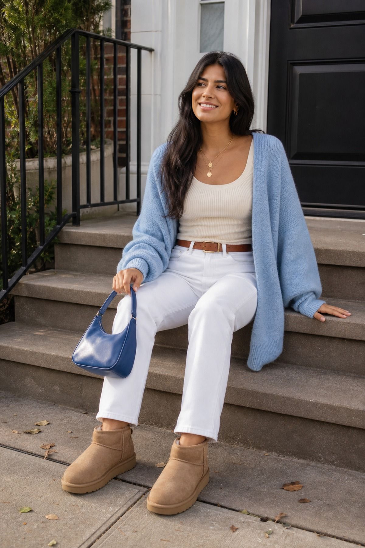 Woman wearing white jeans with Uggs