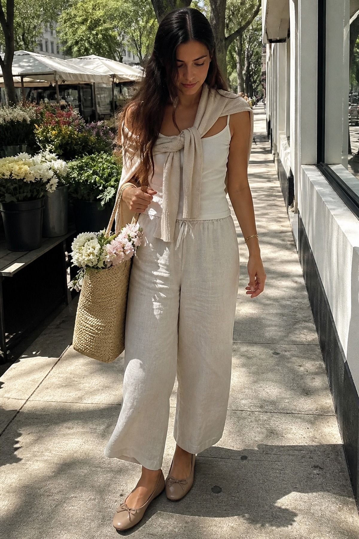 Woman wearing ballet flats with linen trousers and a tank, a balletcore casual outfit