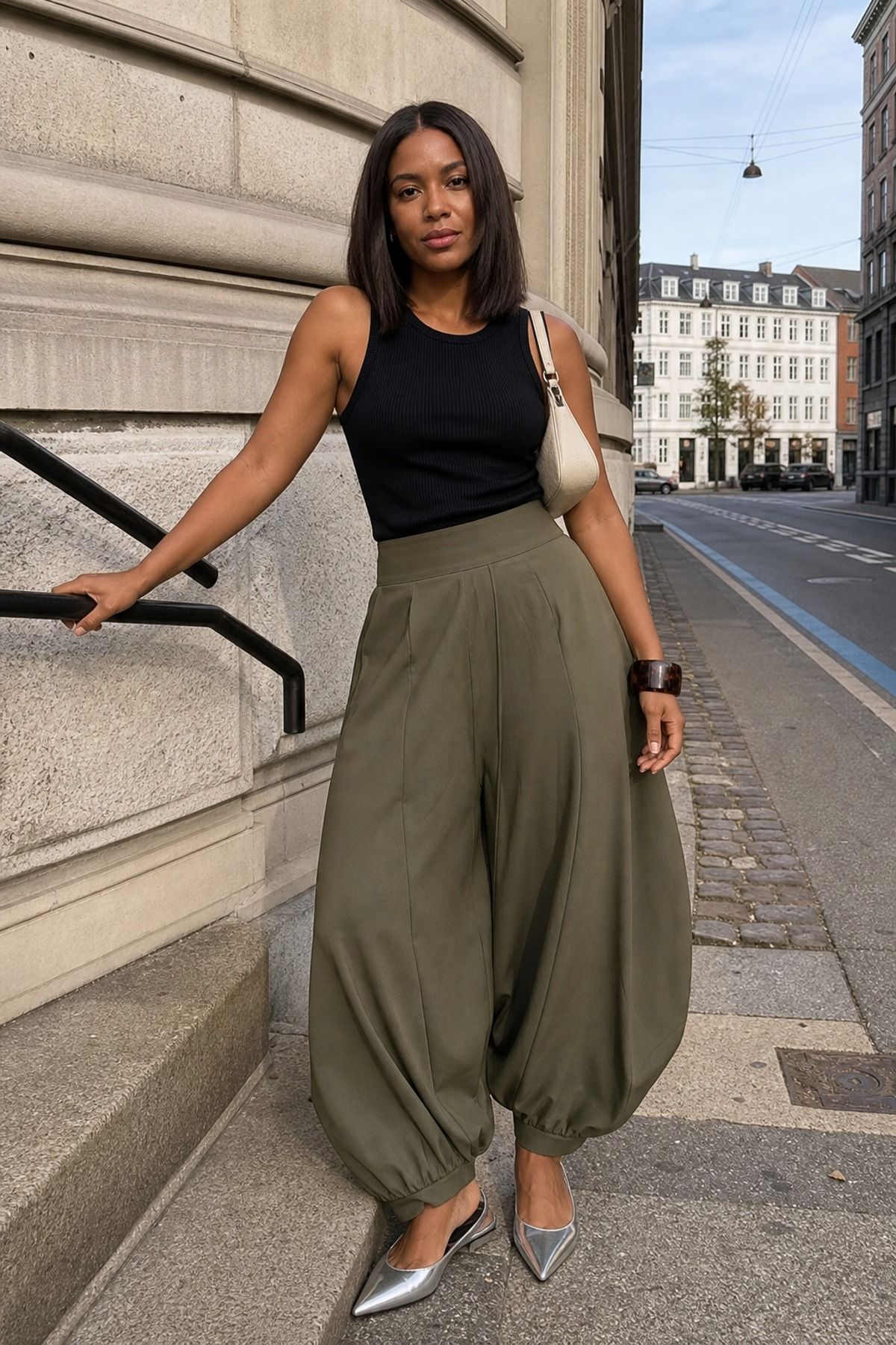 Woman wearing balloon pants with a fitted tank, a copenhagen style outfit