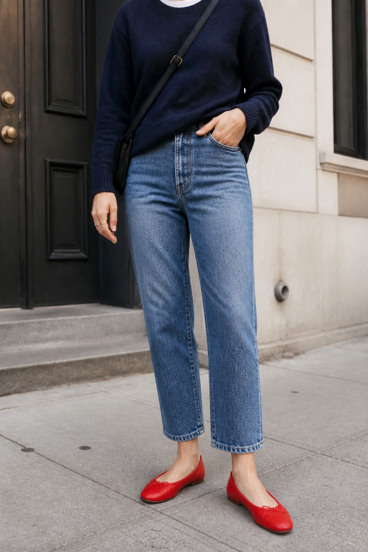 Woman wearing red ballet flats with straight jeans, a copenhagen style outfit