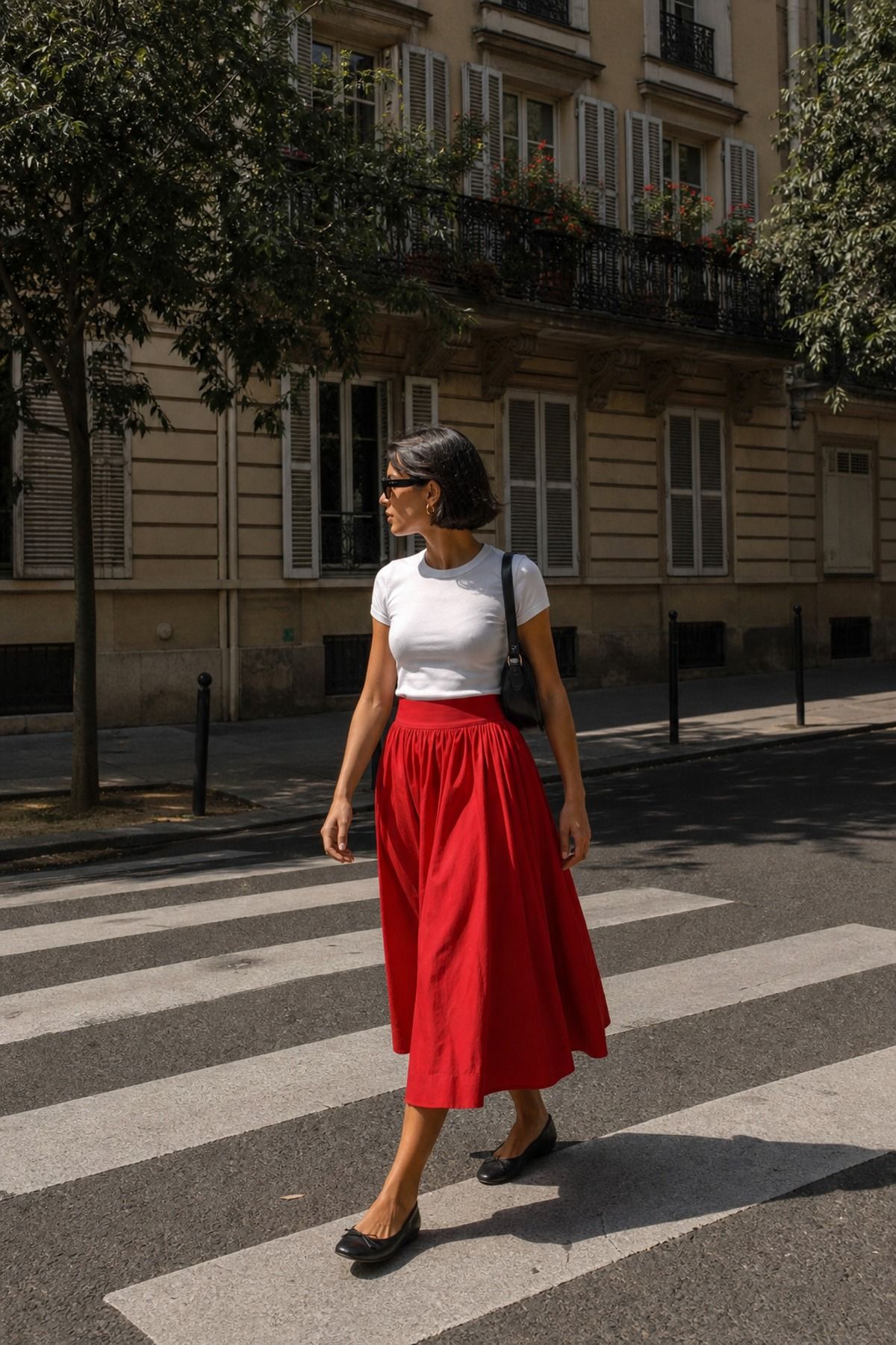Woman wearing a poplin midi skirt with a fitted tee, a European summer outfit