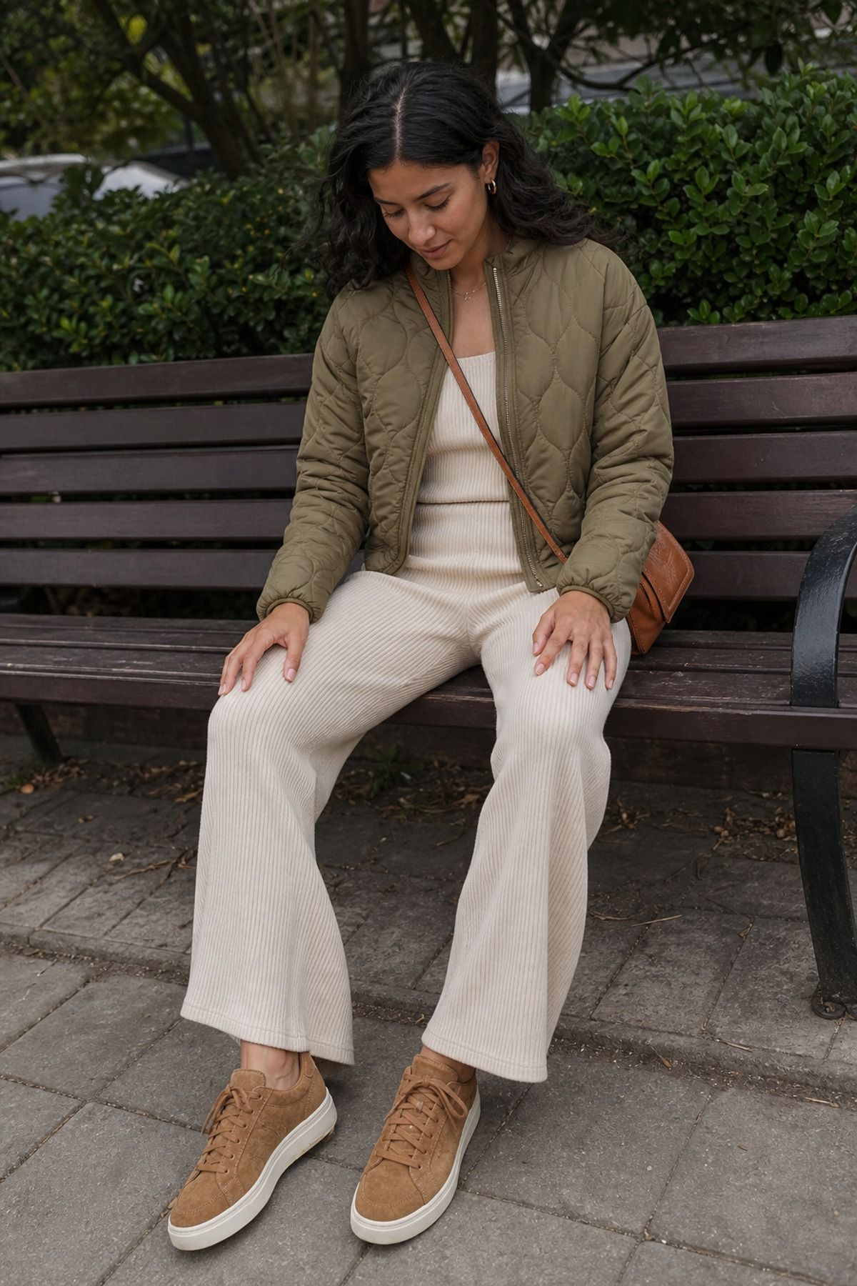 Woman wearing a quilted jacket with a ribbed set, a Scandinavian style outfit