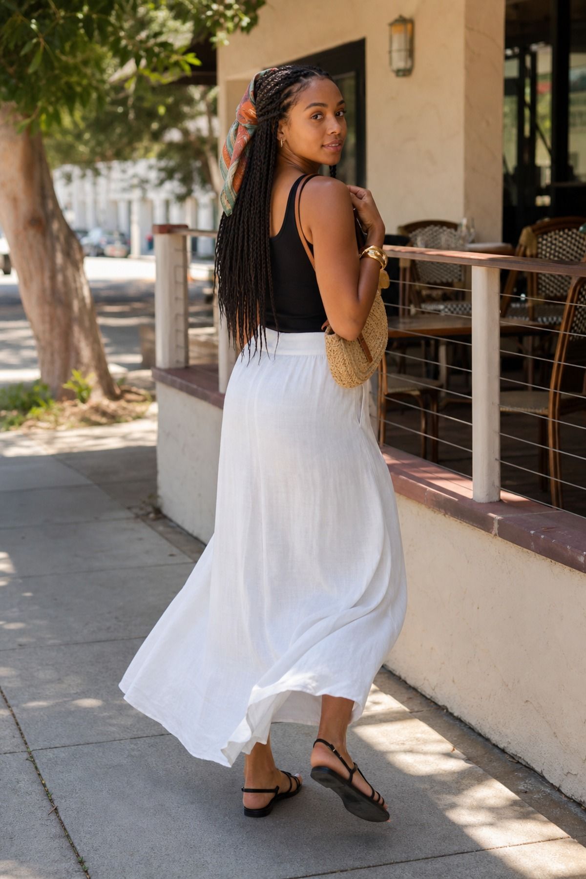 Woman wearing a tank top with a maxi skirt, a Scandinavian style outfit