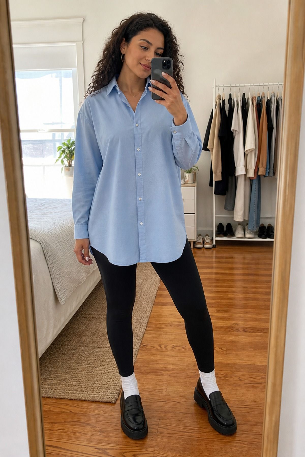 Woman wearing an oversized Oxford with leggings