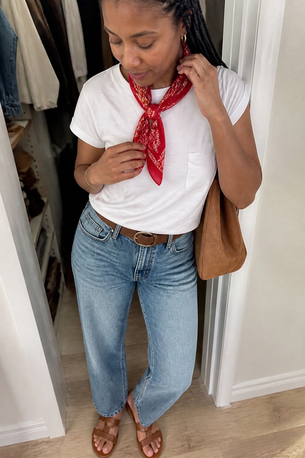 Woman wearing a bandana scarf with white tee and relaxed jeans, a boho casual outfit