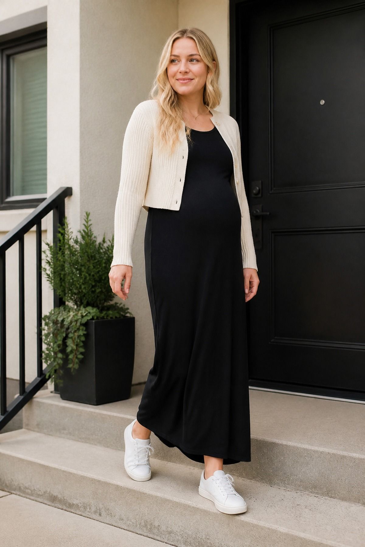 Woman wearing a maxi dress with a cropped cardigan, a casual mom outfit