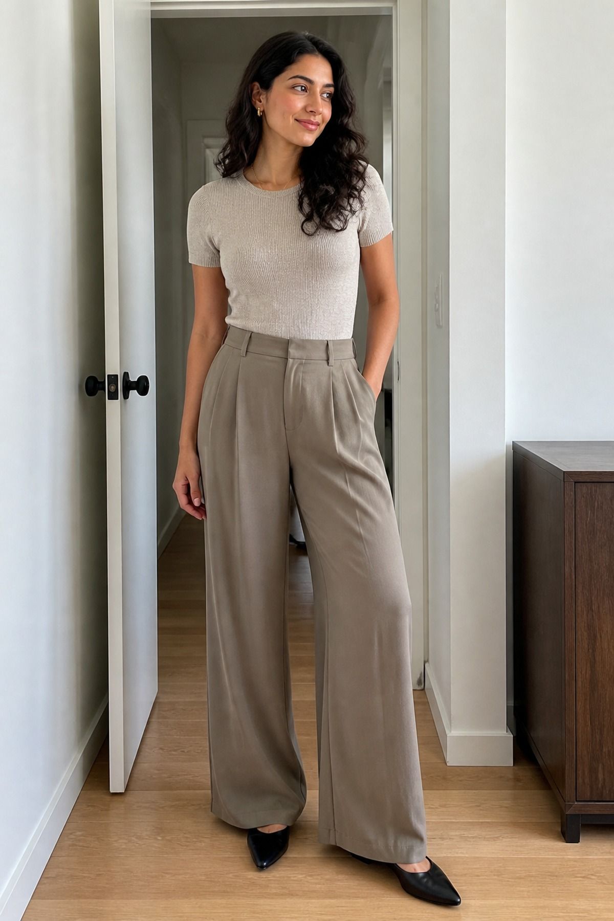 Woman wearing a fine-knit tee with wide-leg trousers