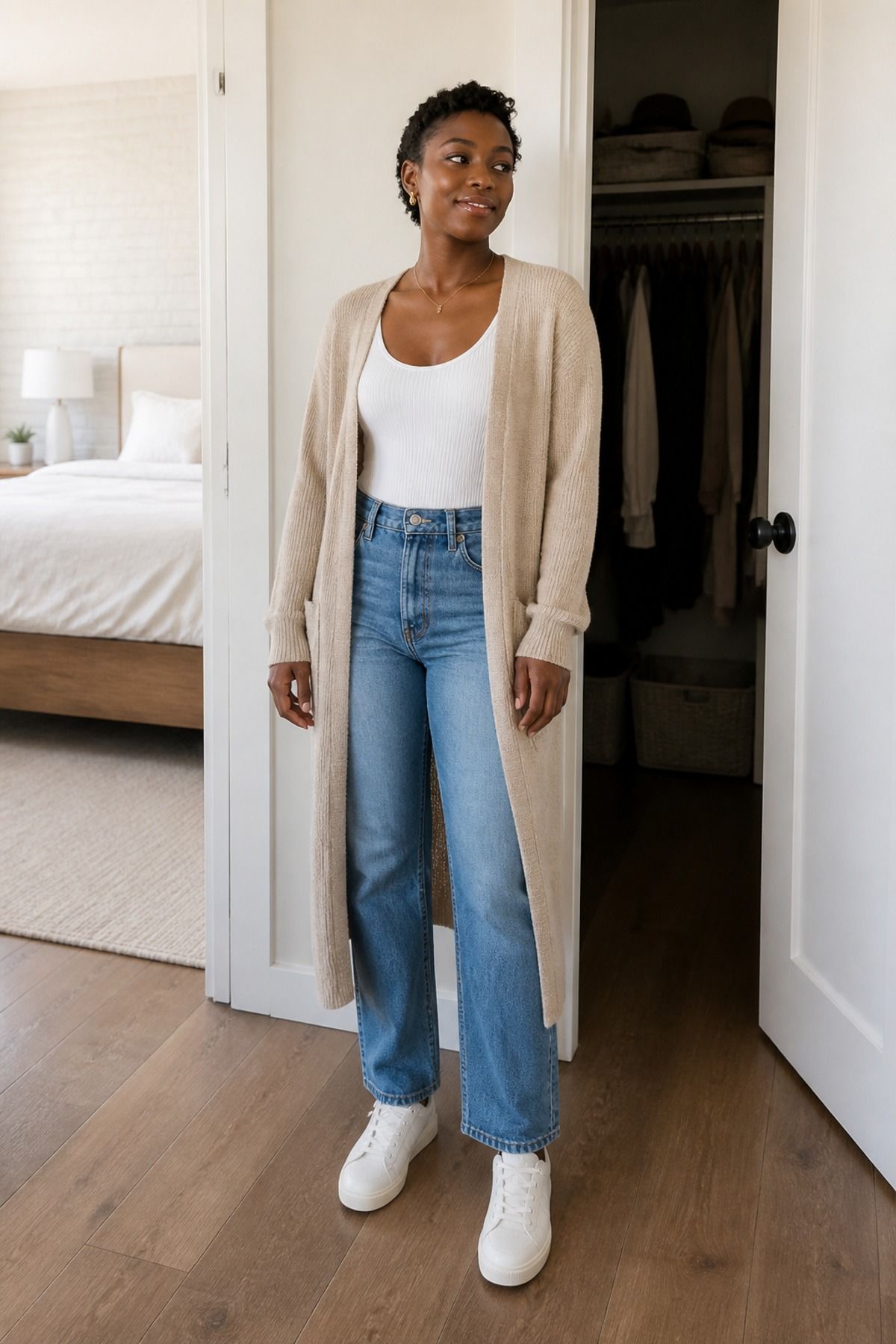 Woman wearing a ribbed tank with a longline cardigan