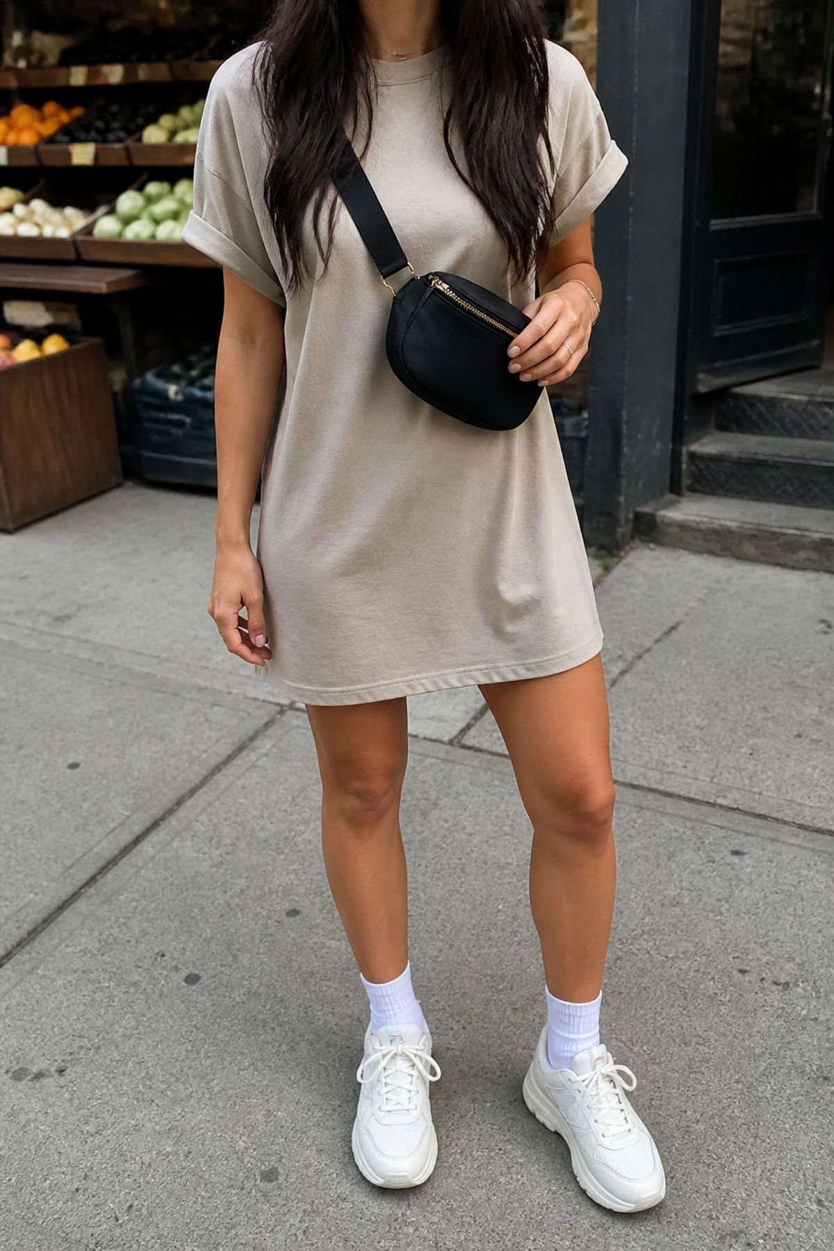 Woman wearing a t-shirt dress with a belt bag