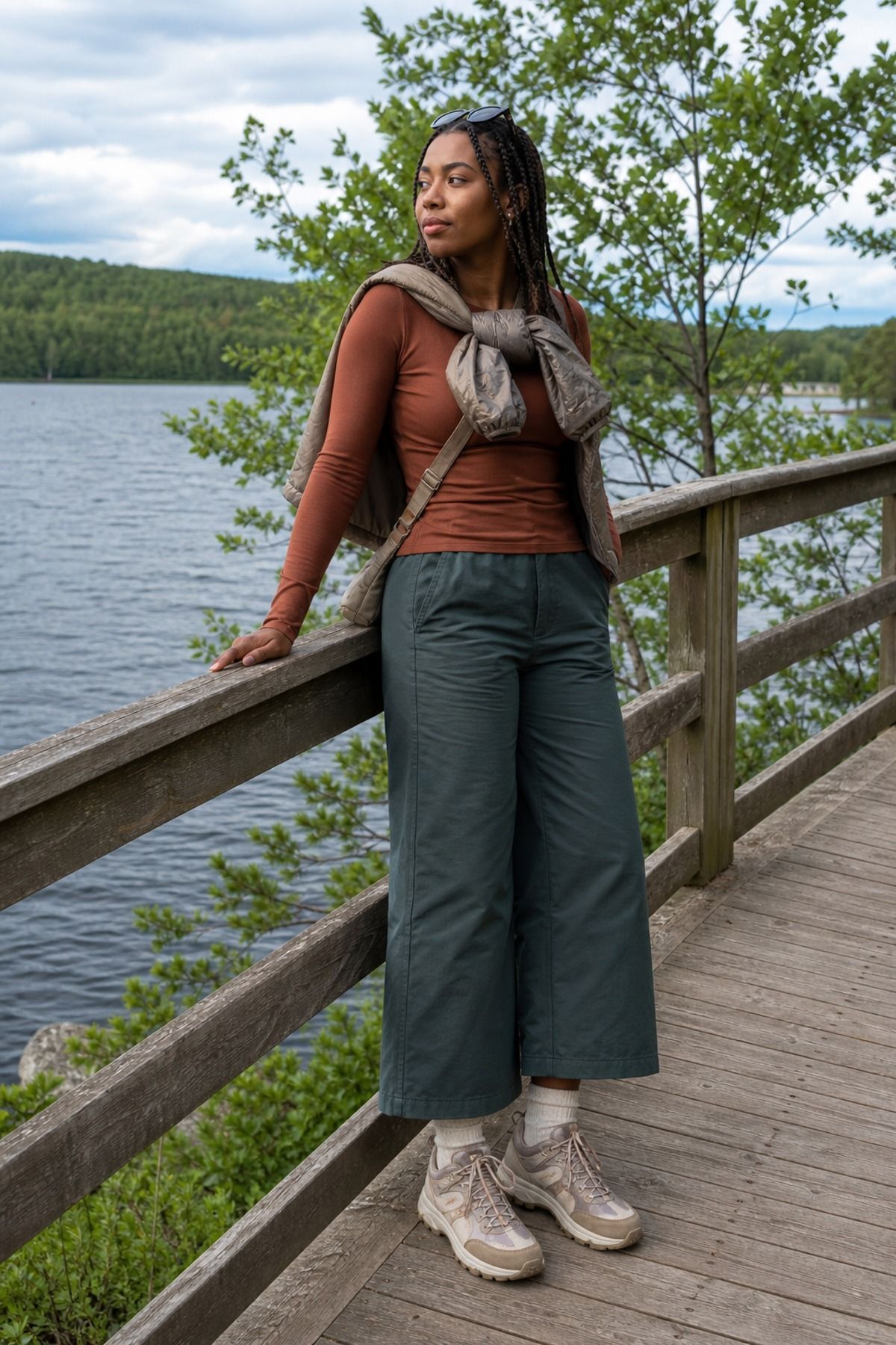 Woman wearing a merino base layer with wide-leg outdoor pants, a granola girl outfit