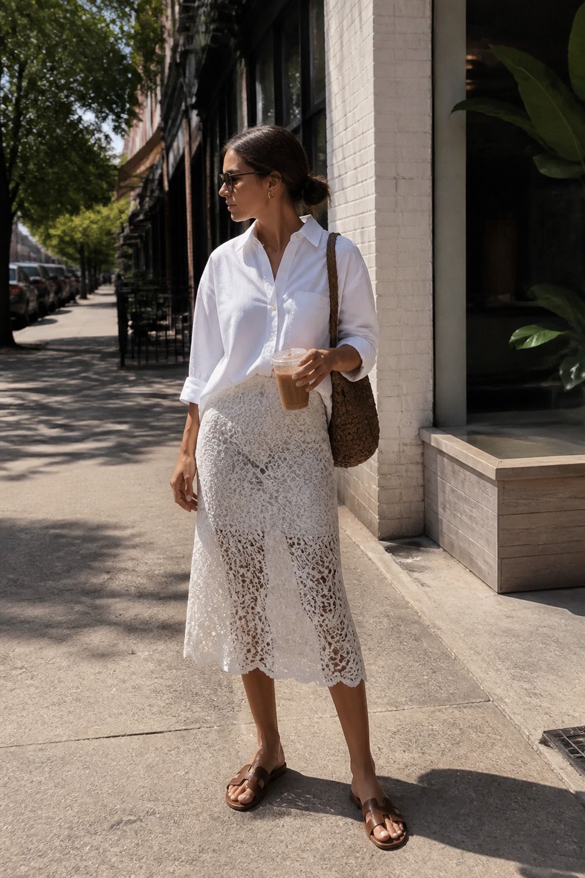 Woman wearing a white lace skirt with a cotton button down