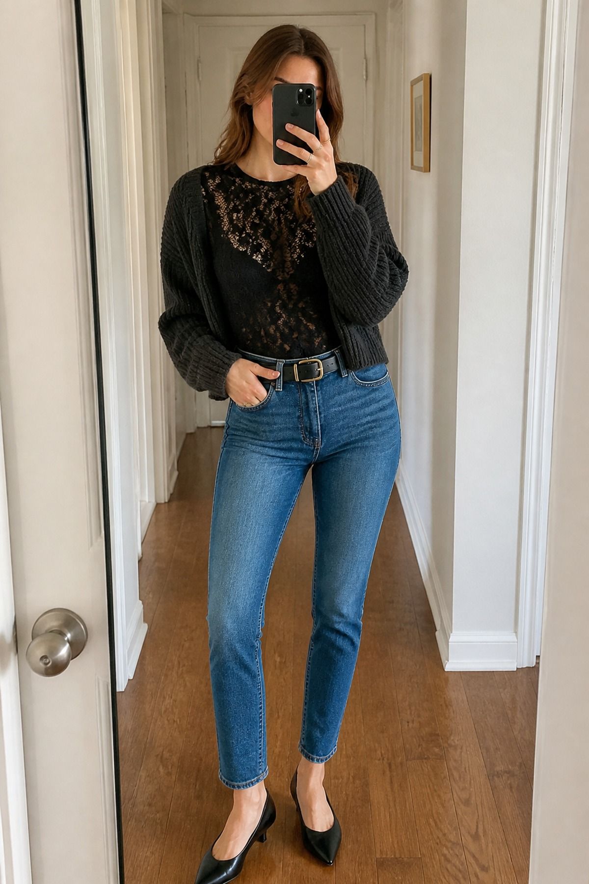 Woman wearing a lace bodysuit with high rise jeans