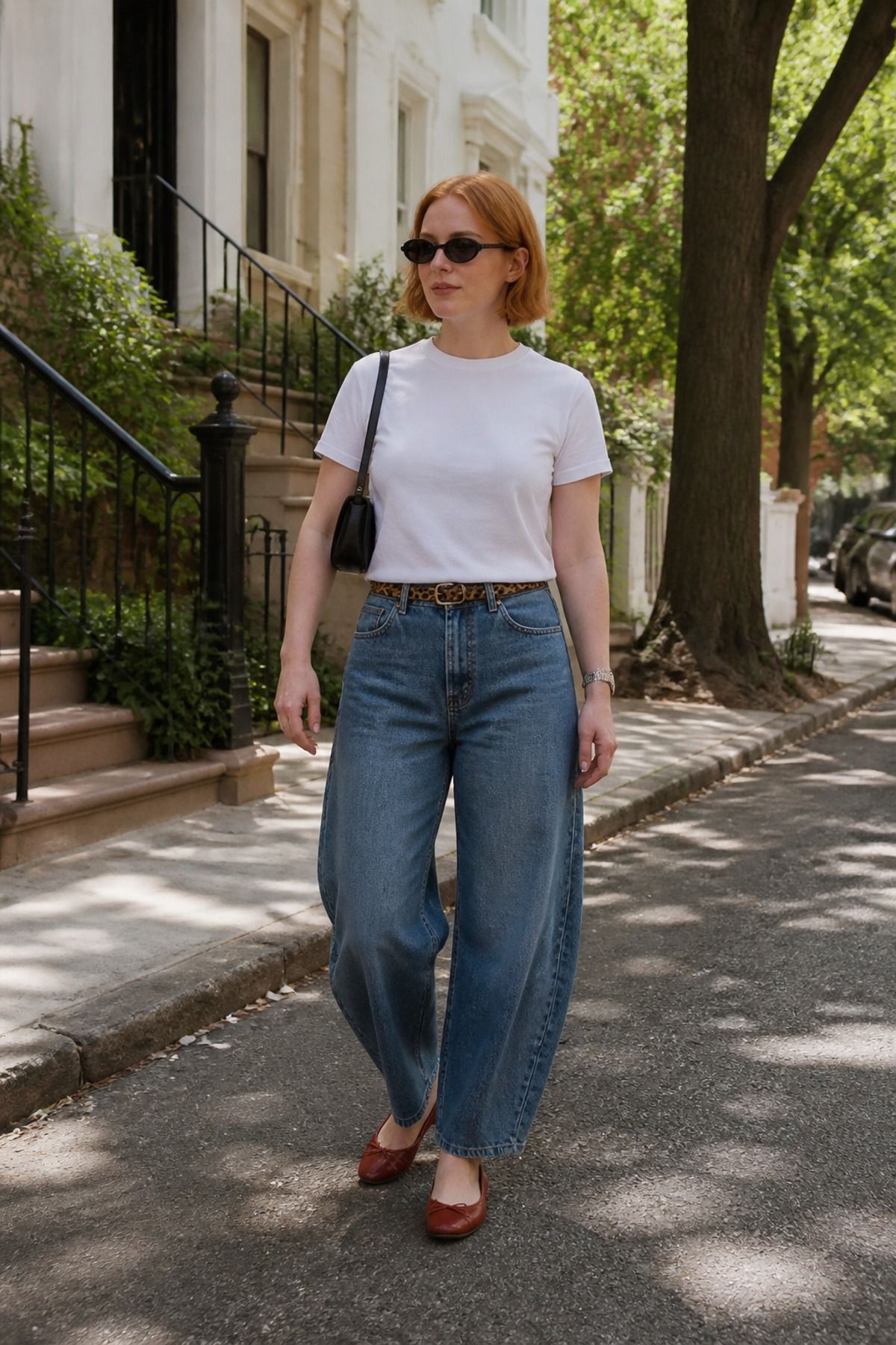 Woman wearing a white tee with barrel jeans and ballet flats, a midsize casual outfit
