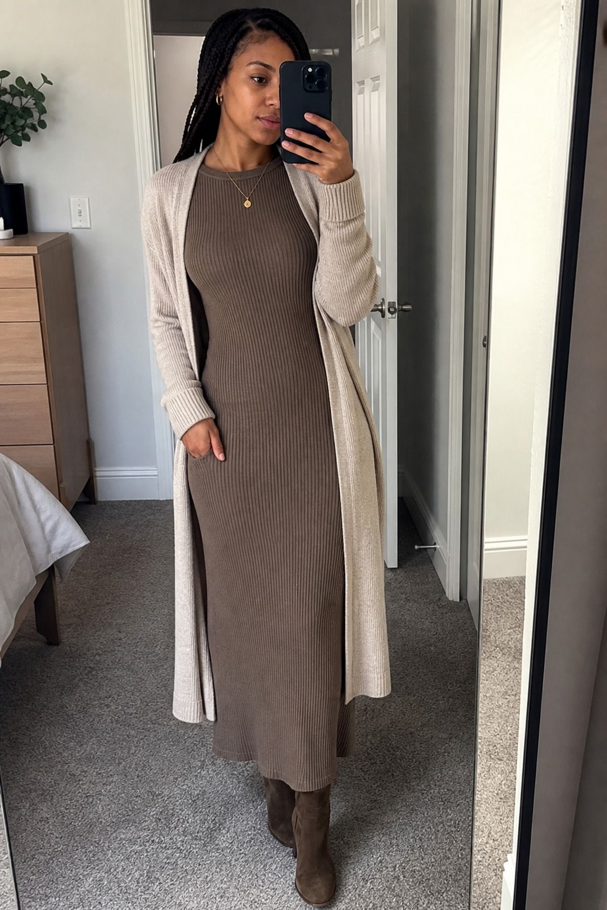 Woman wearing an open cardigan with a ribbed column dress