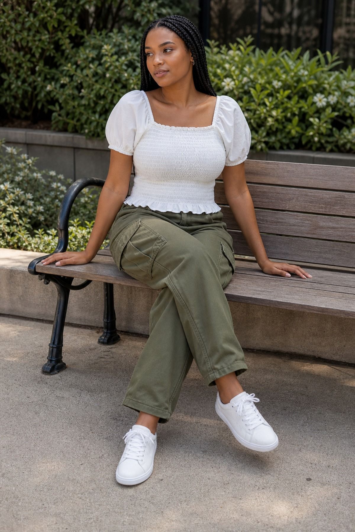 Woman wearing a smocked blouse with relaxed cargo pants