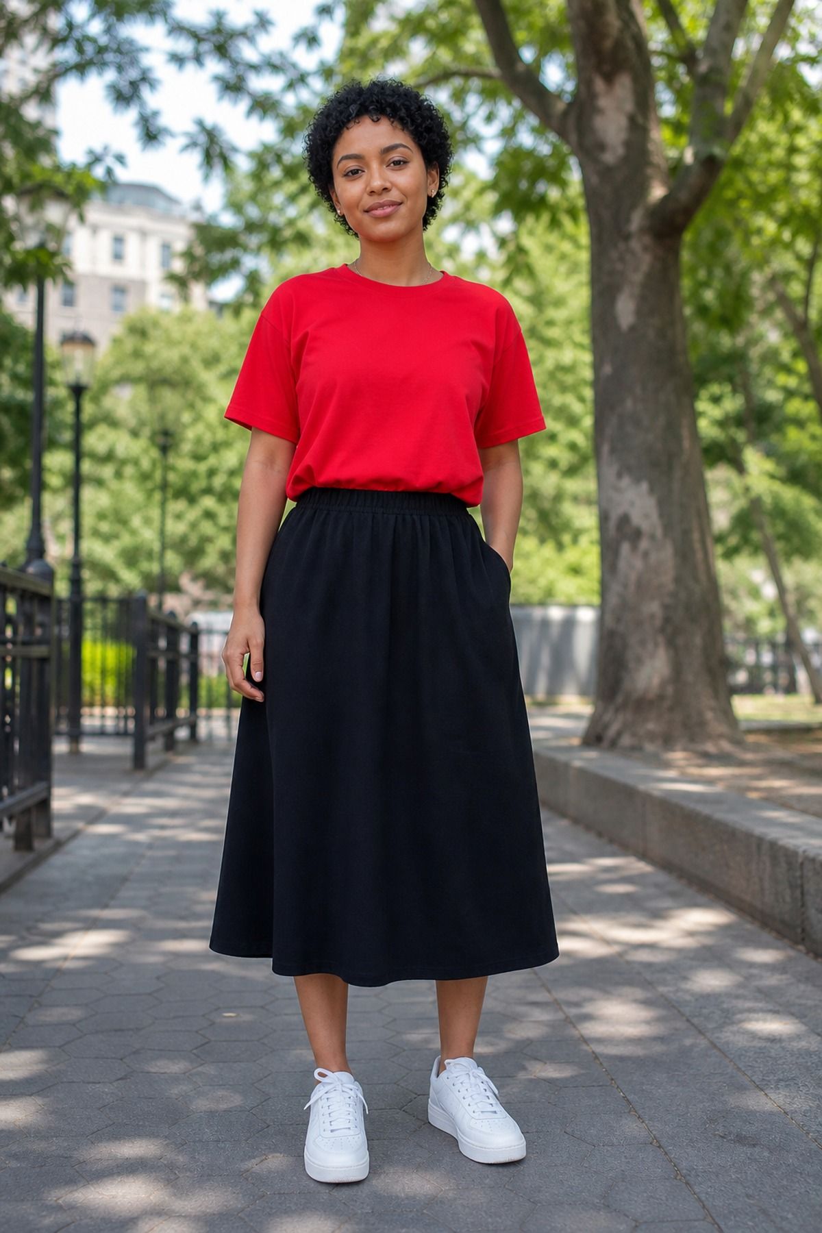 Woman wearing a statement tee with an elastic-waist skirt