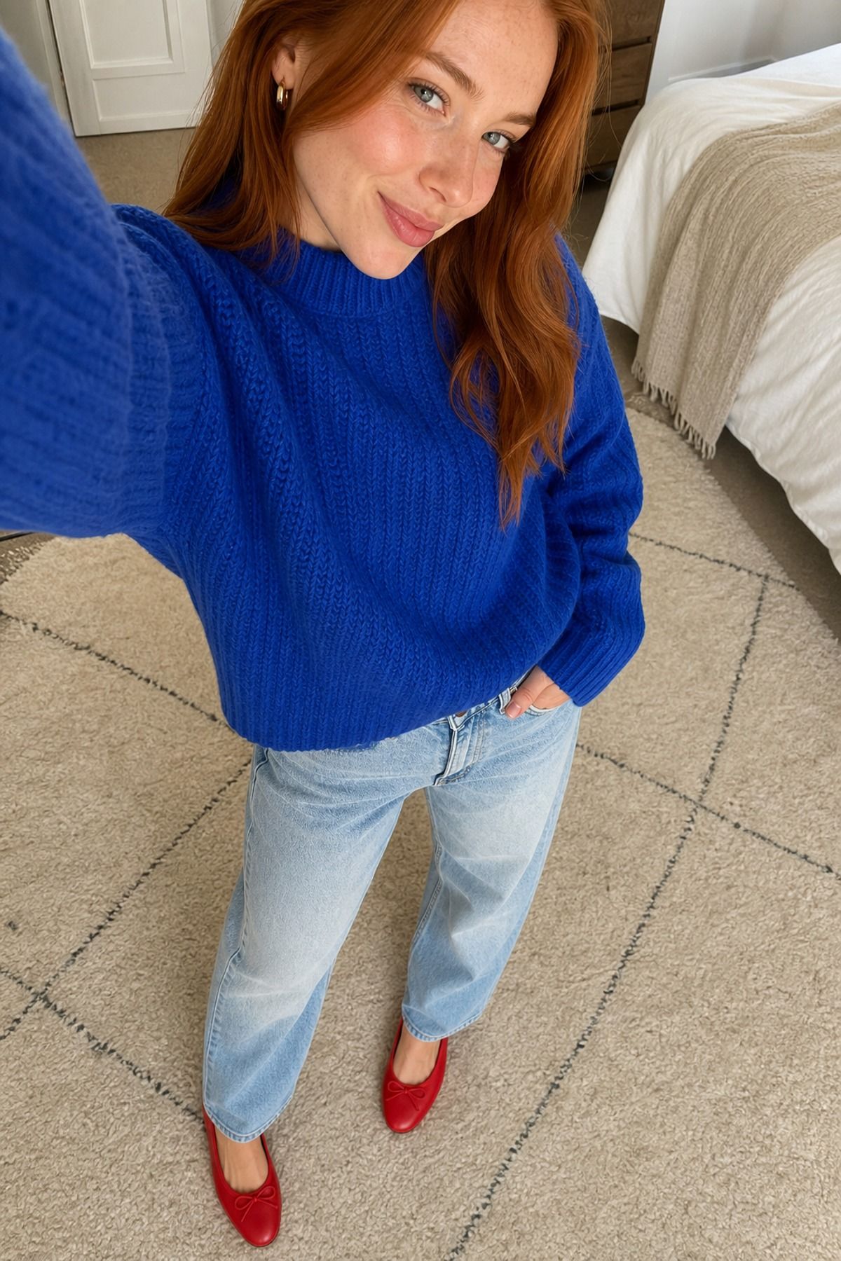 Woman wearing a bright sweater with relaxed jeans