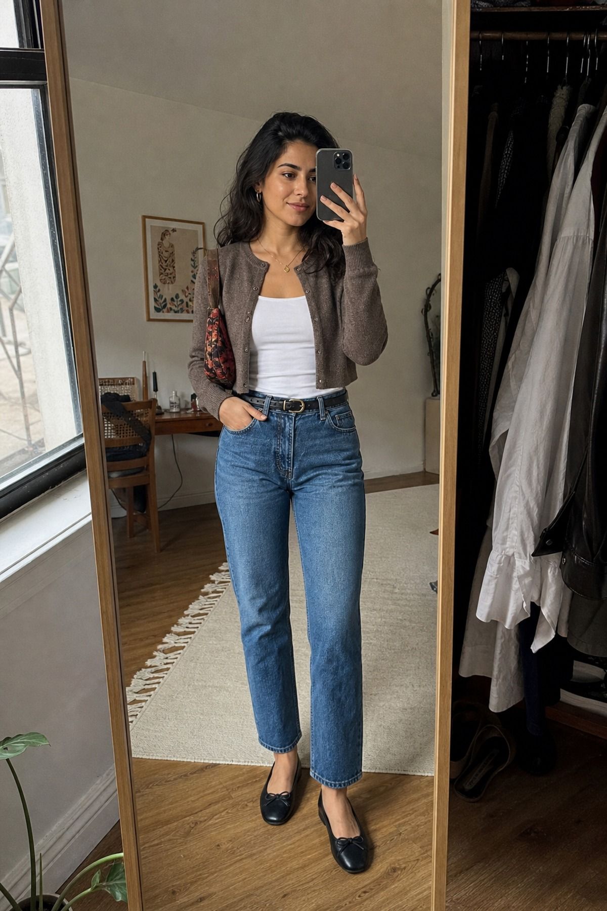 Woman wearing high-rise straight jeans with a cropped cardigan, a petite casual outfit