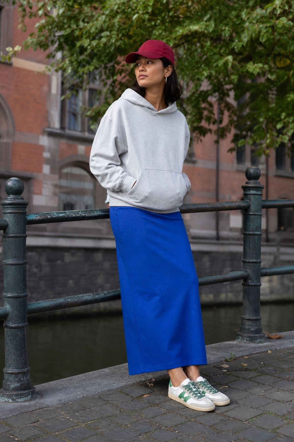 Woman wearing a relaxed hoodie with a column skirt, a tall girl casual outfit