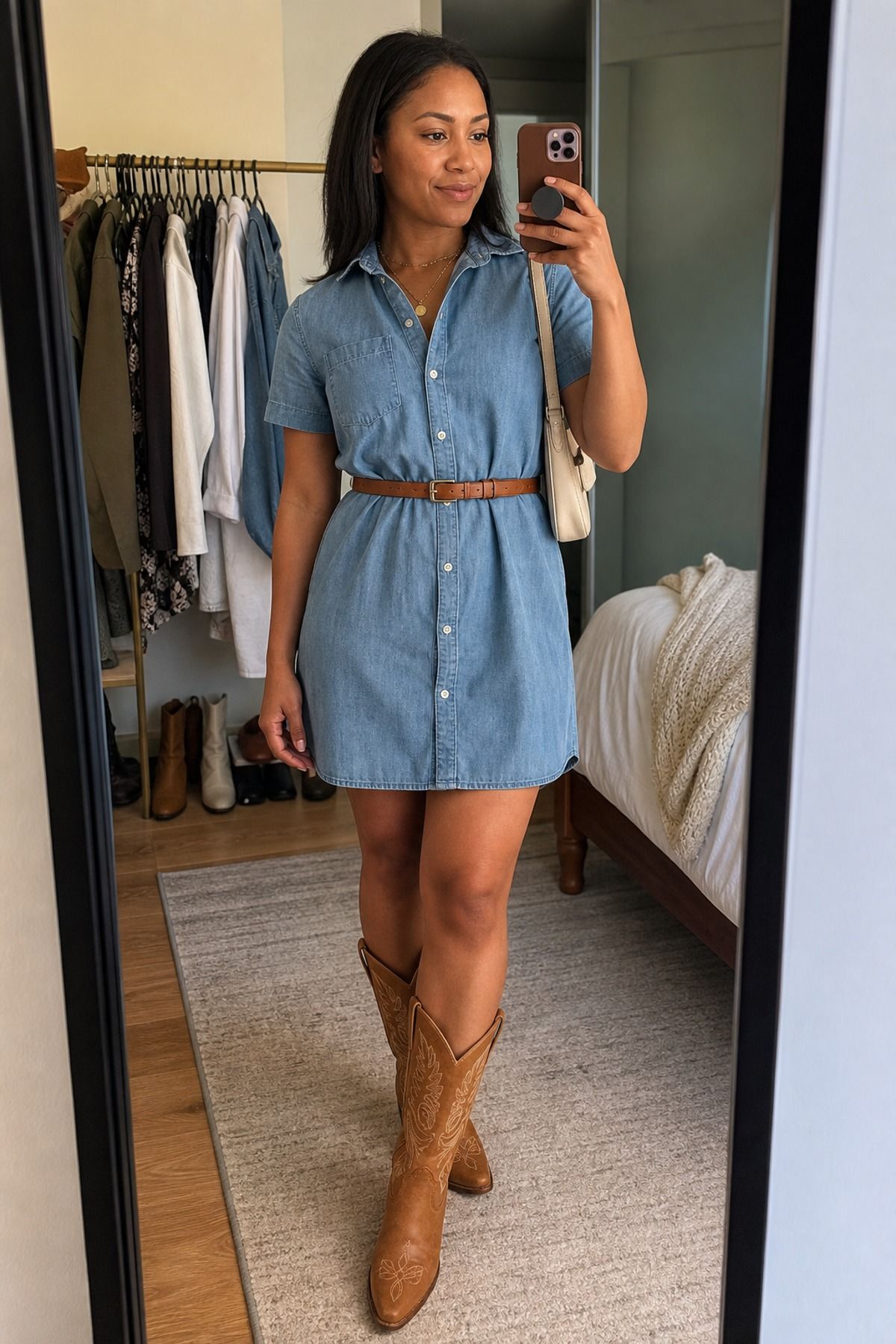 Woman wearing a chambray dress with tan Western boots, a Western casual outfit