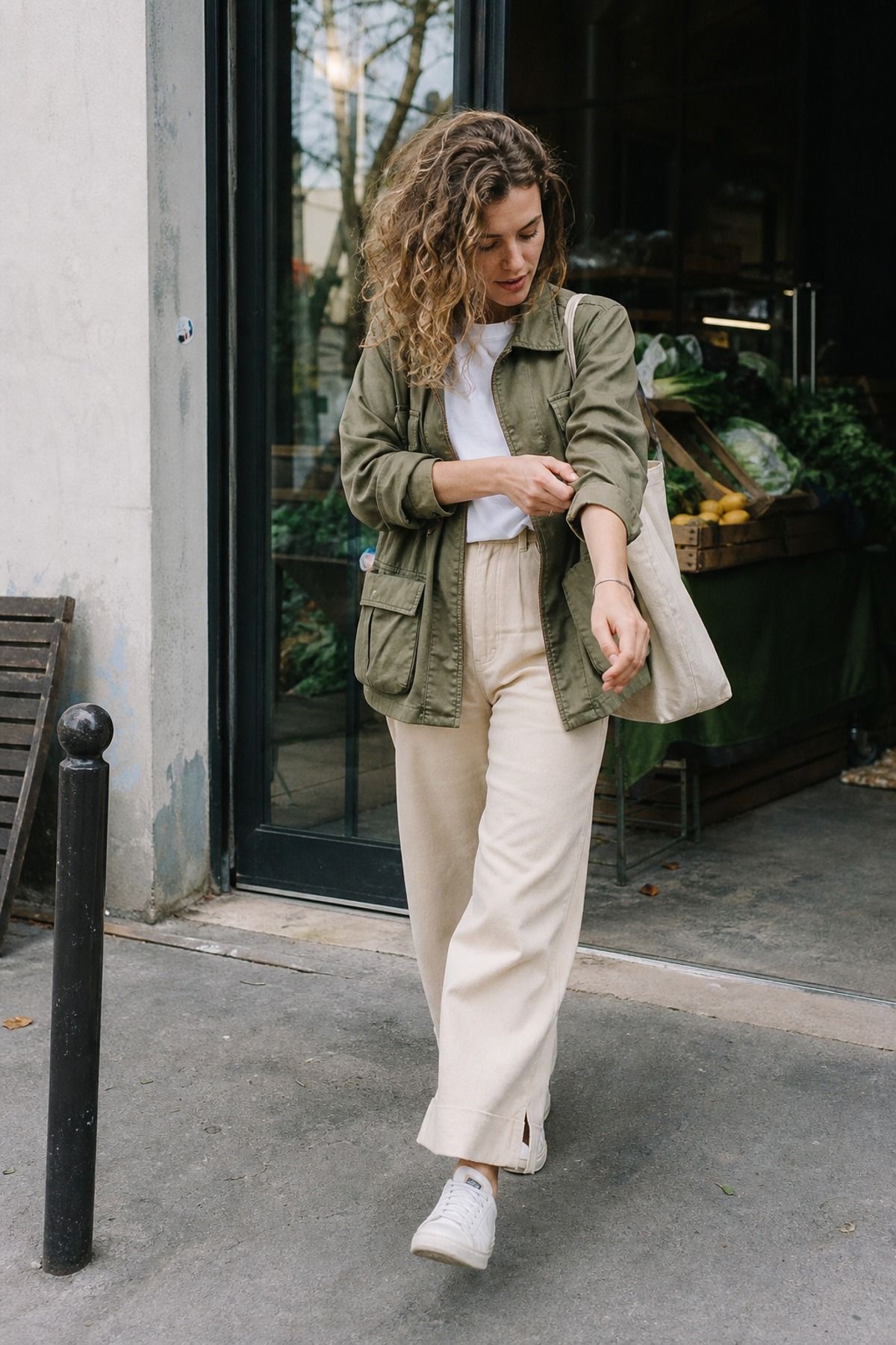 Woman wearing an olive jacket with beige pants