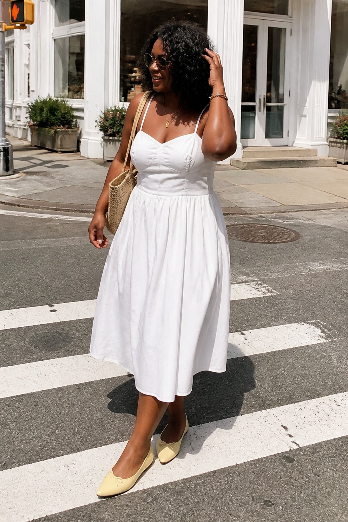 Woman wearing a white dress with butter yellow flats