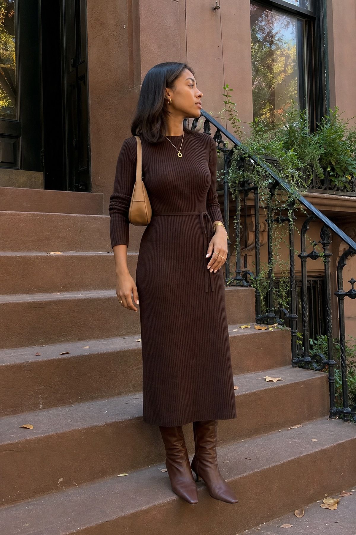 Woman wearing a chocolate brown dress with brown boots, a monochrome outfit