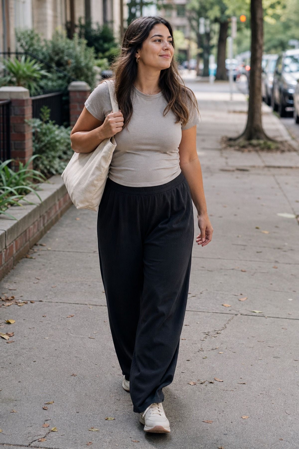 Woman wearing a soft tee with pull-on wide-leg pants, a postpartum outfit