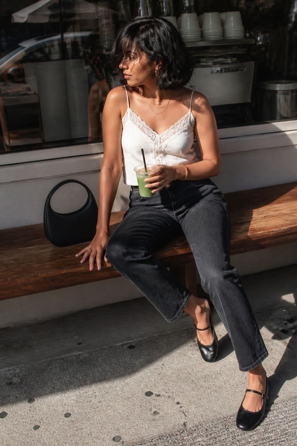 Woman wearing dark jeans with a lace cami, a casual Valentine s day outfit