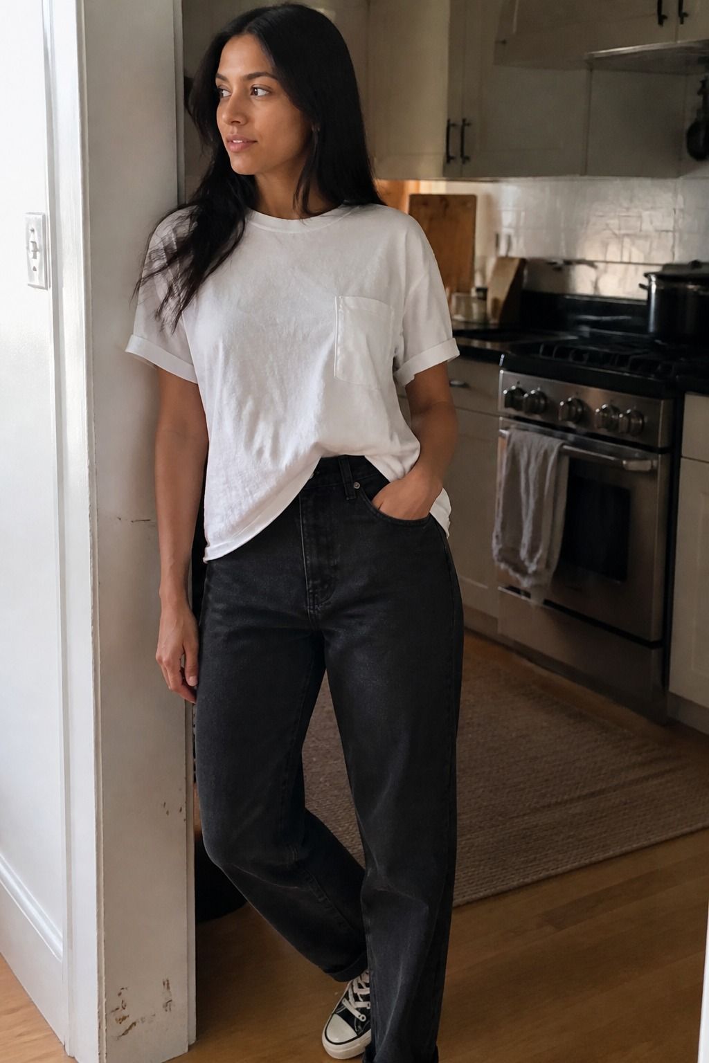 Woman wearing a relaxed white pocket T-shirt with black jeans