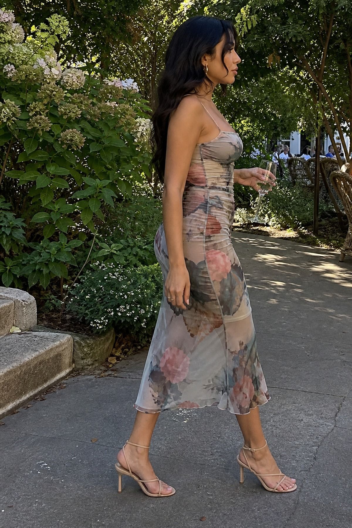 printed mesh midi dress with simple strappy sandals casual wedding guest outfit