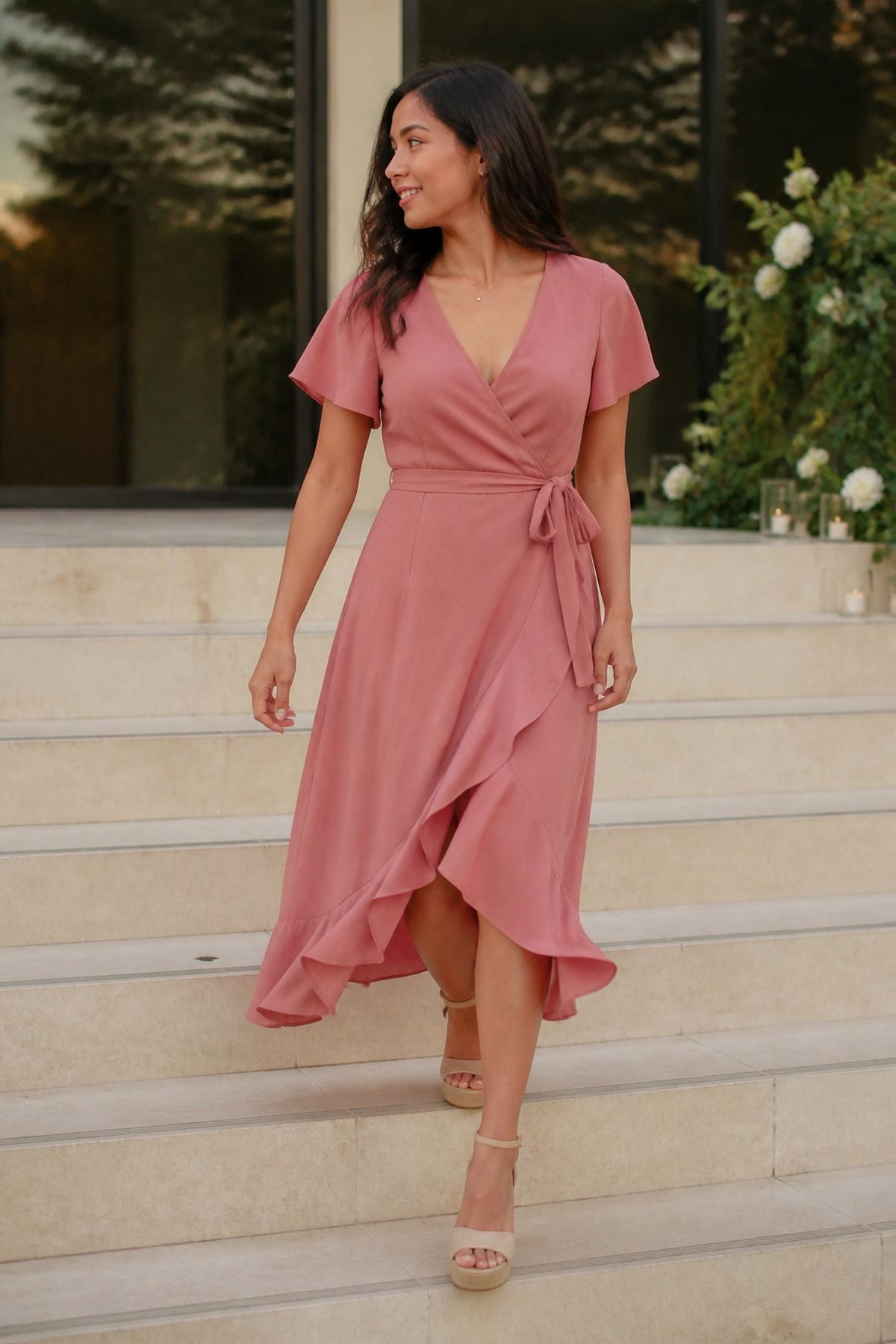soft wrap dress with comfortable platform sandals casual wedding guest outfit