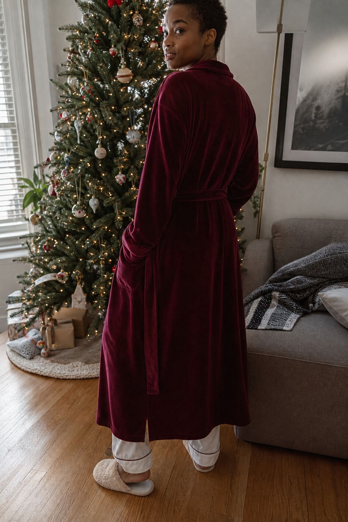 Woman wearing velvet robe over simple pajamas, a Christmas morning outfit