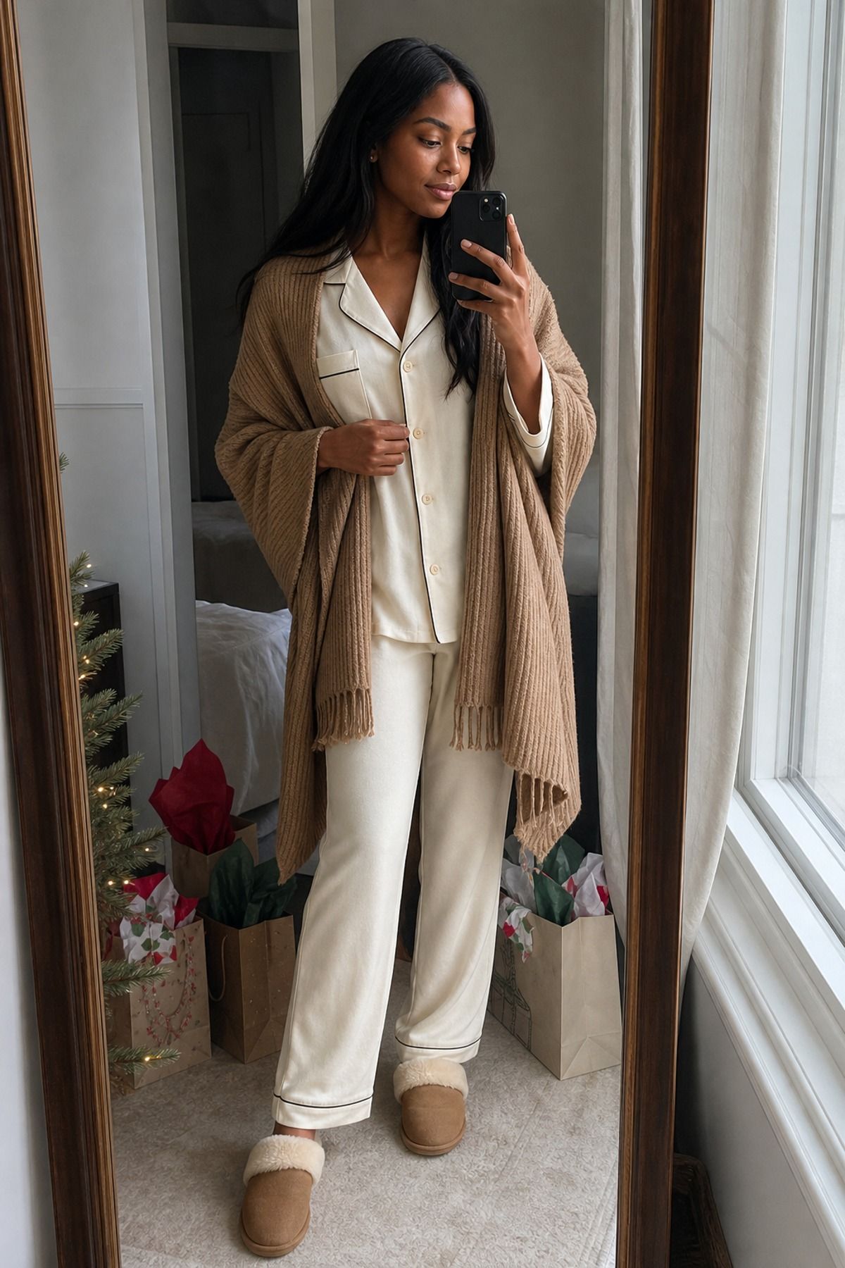 Woman wearing monogram pajamas with a knit wrap, a Christmas morning outfit