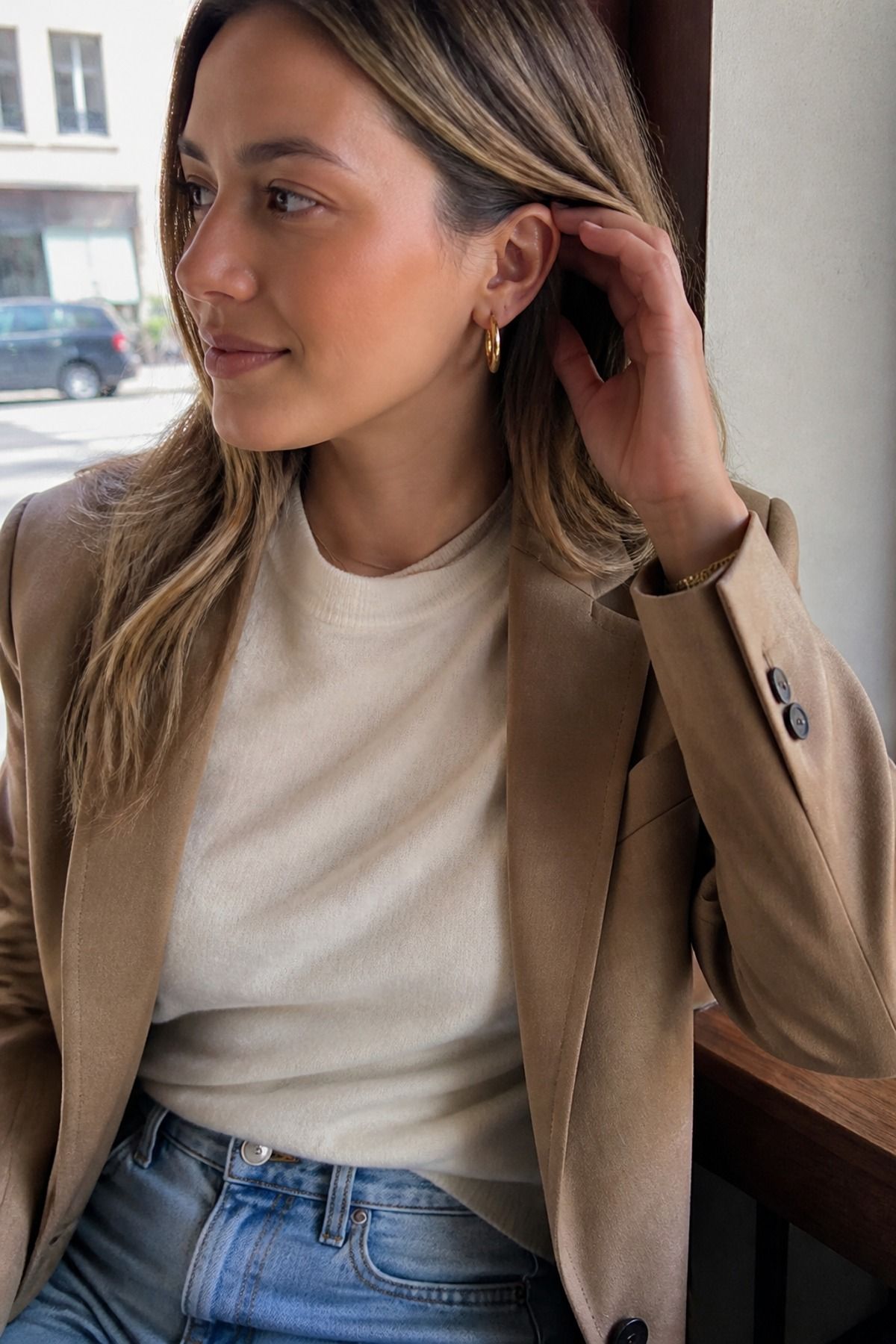 Woman wearing simple hoops