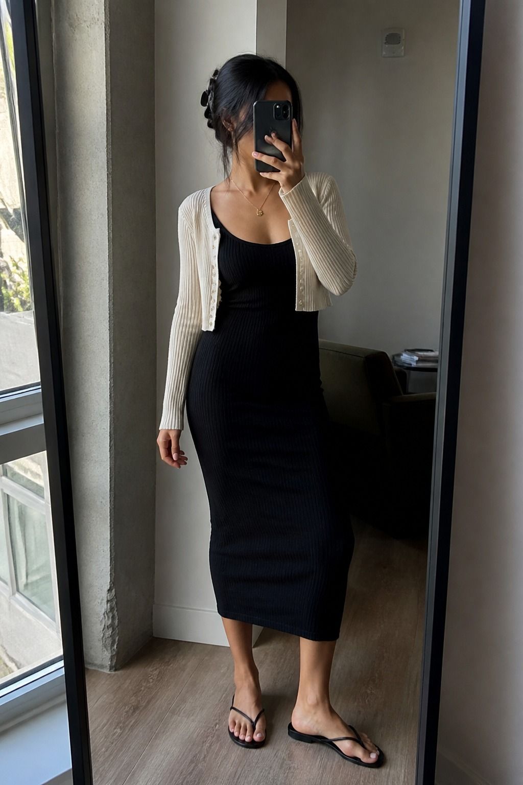 Woman wearing ribbed tank dress with a cropped cardigan for a spring travel outfit