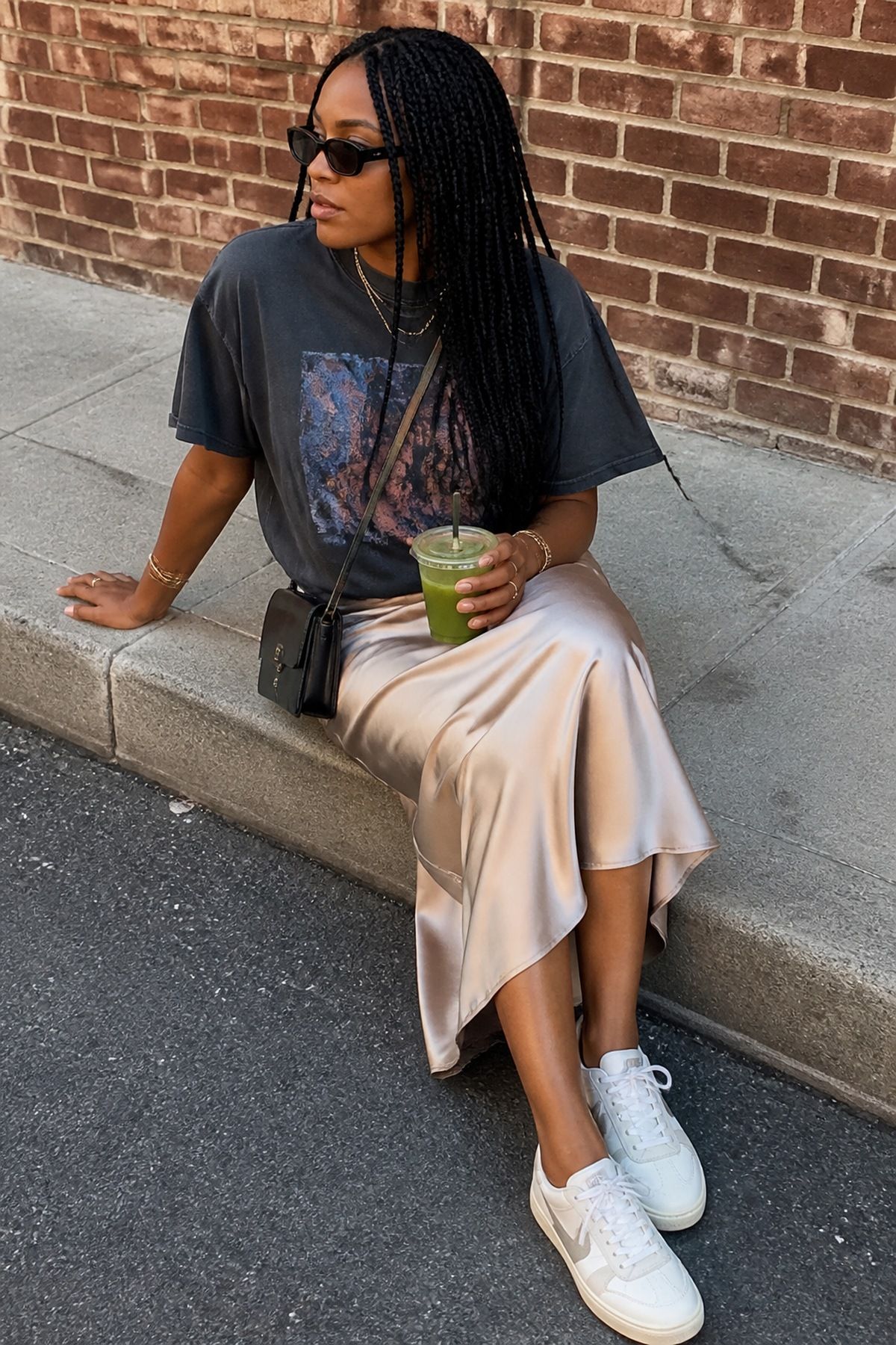 Woman wearing a graphic tee with a satin midi skirt, a Target outfit